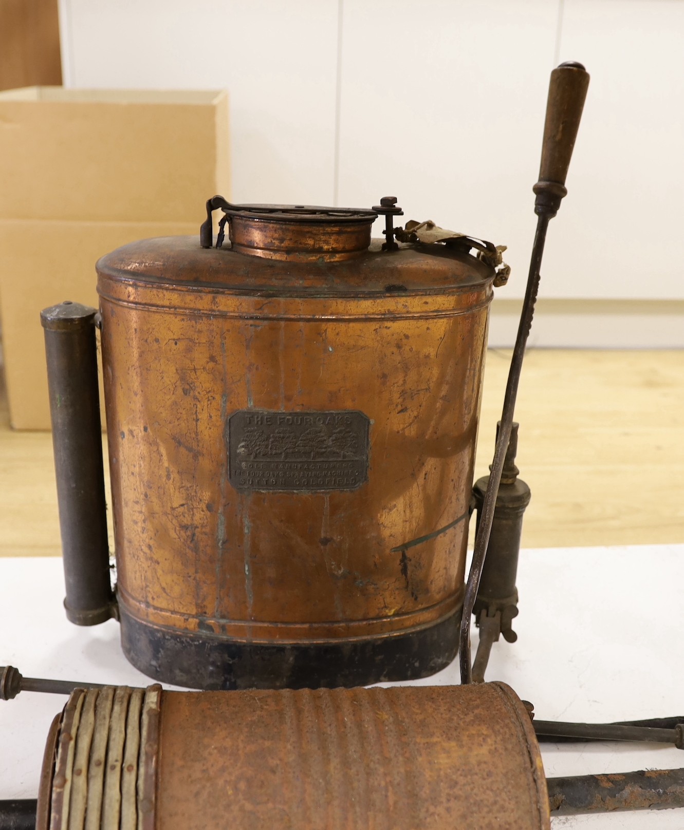 Vintage copper apple sprayer and a Star Vacuum Cleaner